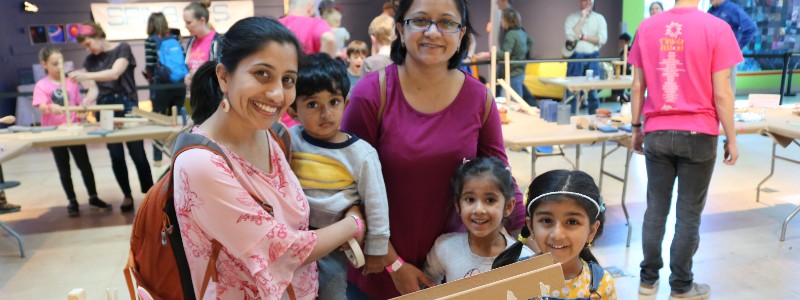 Visitors smiling for a photo during a workshop at the Center. 