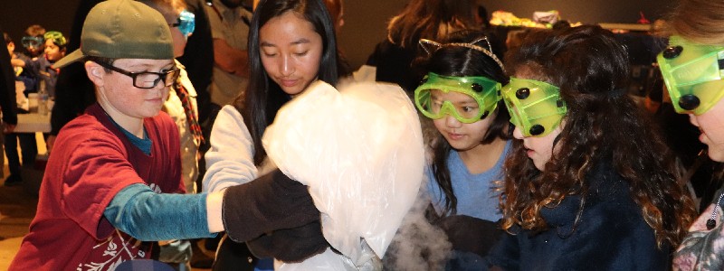 A group of young visitors participating in a workshop.