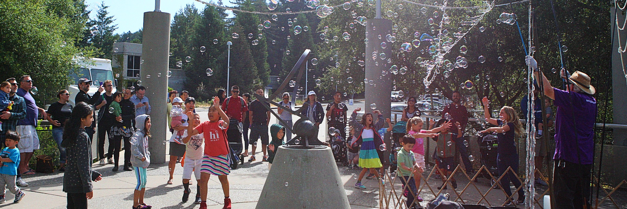 Visitors near the front entrance enjoying bubbles on a sunny day during our annual Bubblefest. 